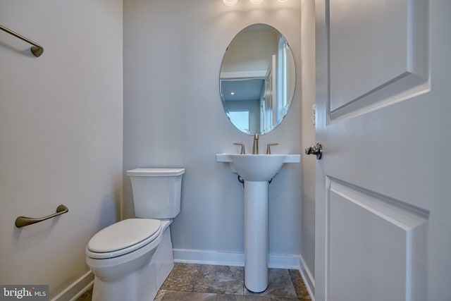 bathroom featuring toilet