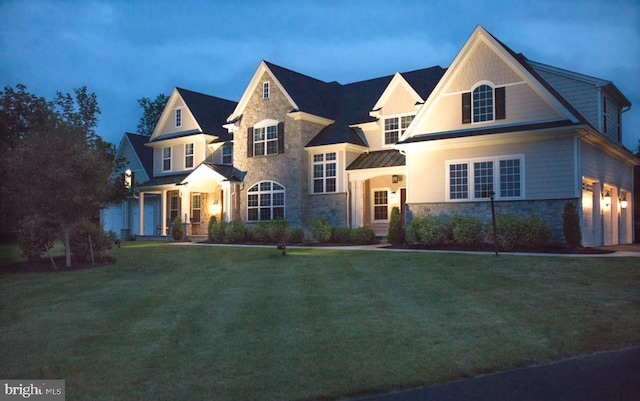 view of front of property with a yard