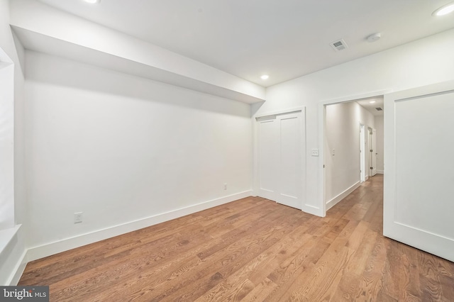 unfurnished room featuring light hardwood / wood-style floors