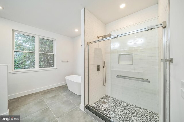 bathroom with plus walk in shower and tile patterned floors