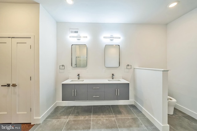 bathroom with tile patterned flooring and vanity