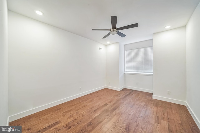 spare room with ceiling fan and light hardwood / wood-style flooring