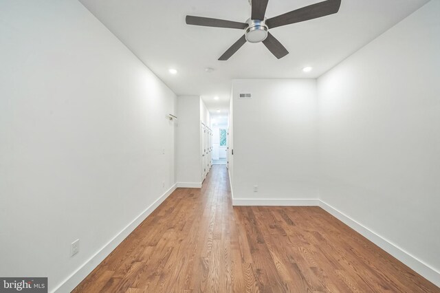 spare room featuring ceiling fan and hardwood / wood-style floors