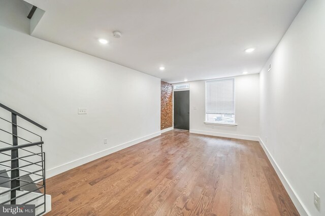 empty room featuring hardwood / wood-style flooring