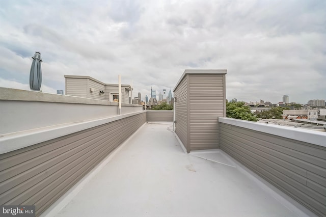 view of patio featuring a balcony