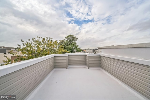 view of patio featuring a balcony