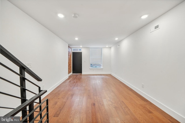 spare room featuring light hardwood / wood-style floors