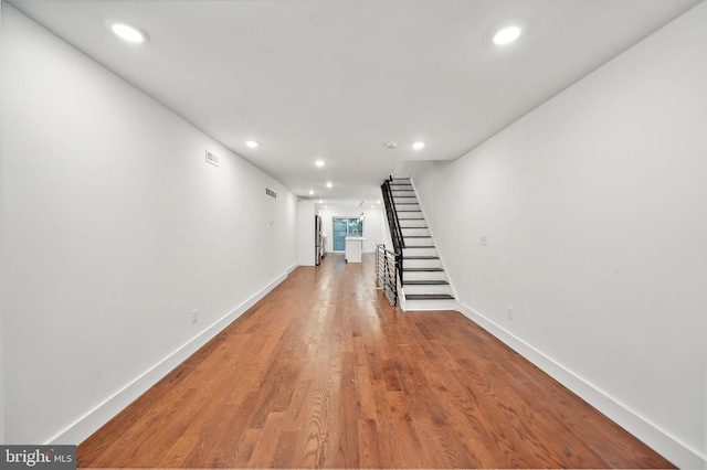 hall with wood-type flooring