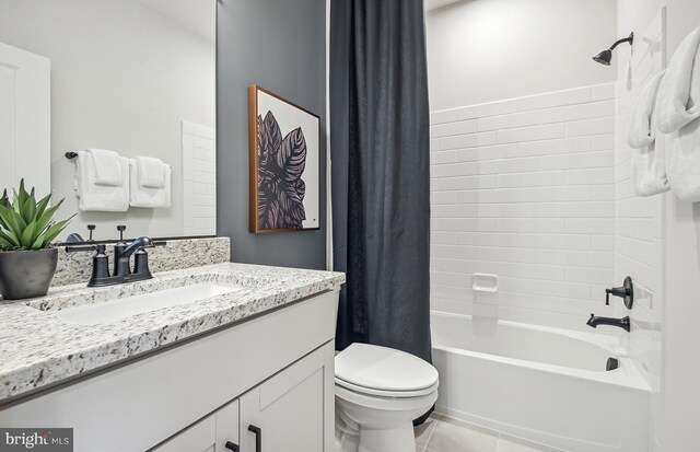 full bathroom with shower / tub combo, vanity, toilet, and tile patterned floors