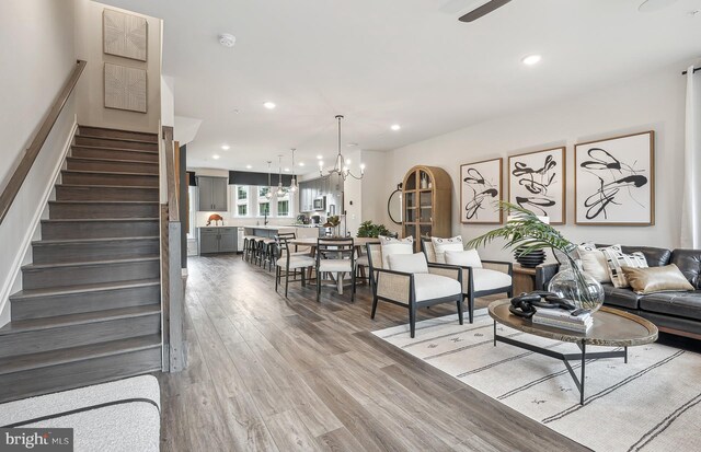 living room with a chandelier and hardwood / wood-style floors