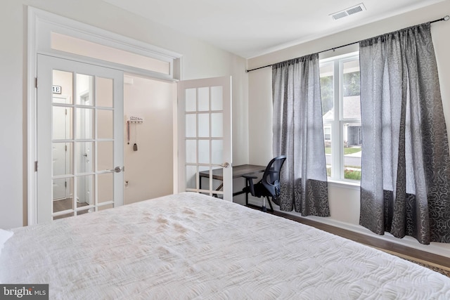 bedroom featuring multiple windows