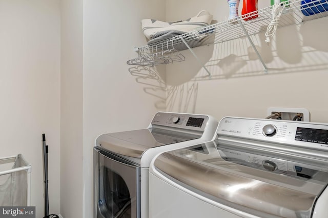 washroom with washing machine and dryer