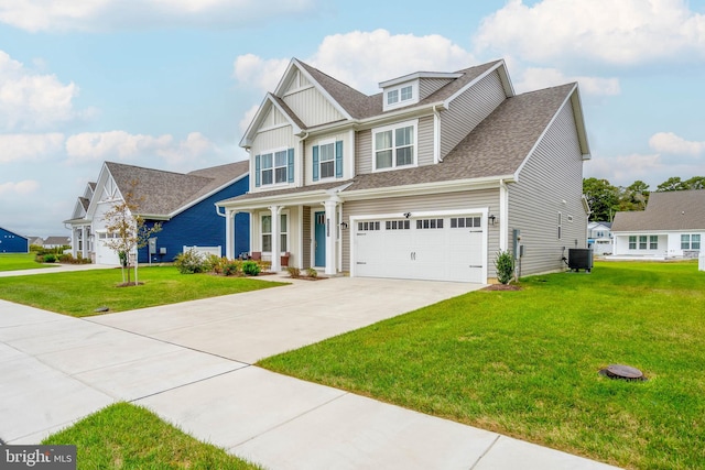 view of front facade featuring a front lawn, central air condition unit, and a garage