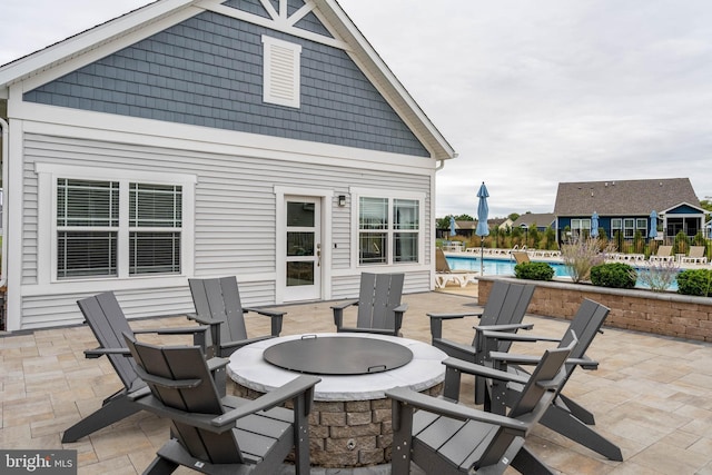 view of patio / terrace with an outdoor fire pit