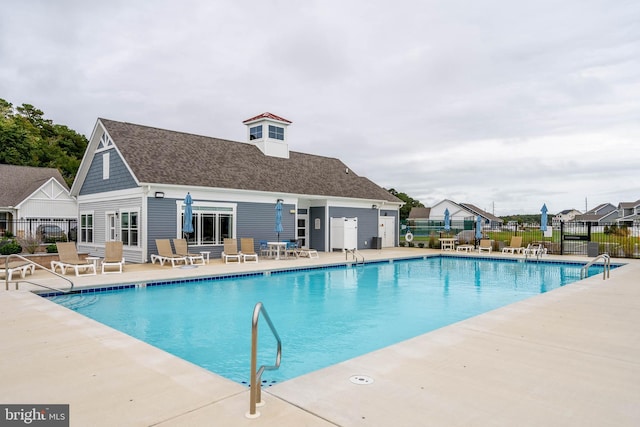 view of swimming pool with a patio area