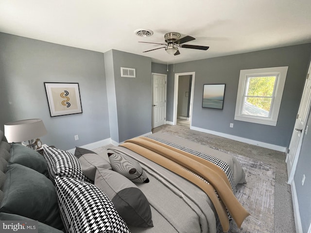 bedroom featuring ceiling fan and carpet