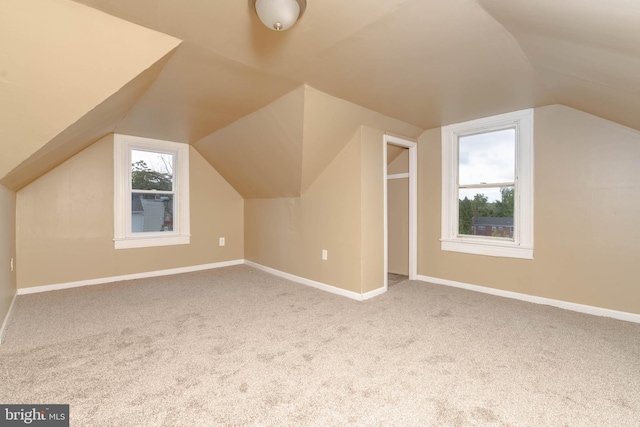 bonus room featuring carpet floors and lofted ceiling