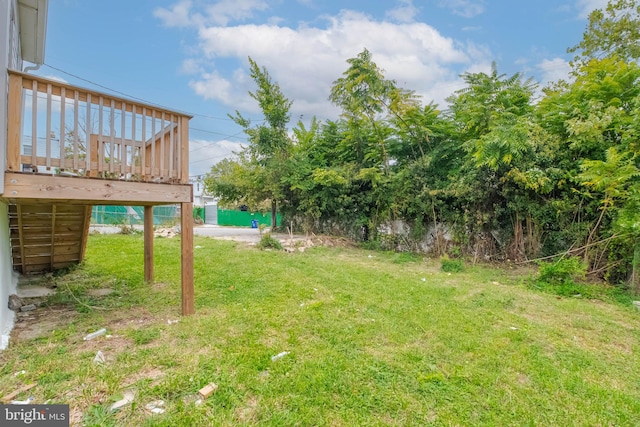 view of yard with a wooden deck