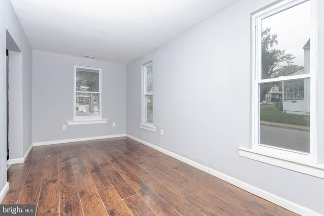 empty room featuring dark hardwood / wood-style floors