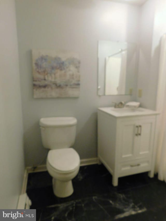 bathroom with vanity and toilet