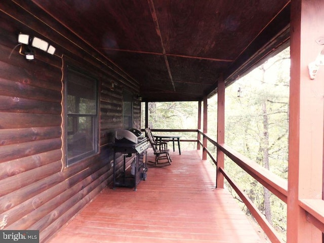 wooden terrace featuring grilling area