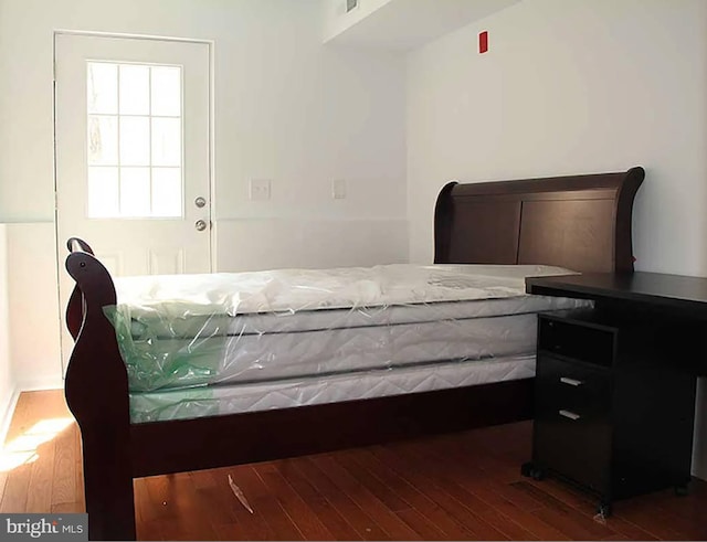 bedroom featuring dark hardwood / wood-style flooring