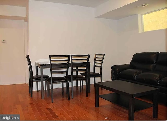 dining room with wood-type flooring