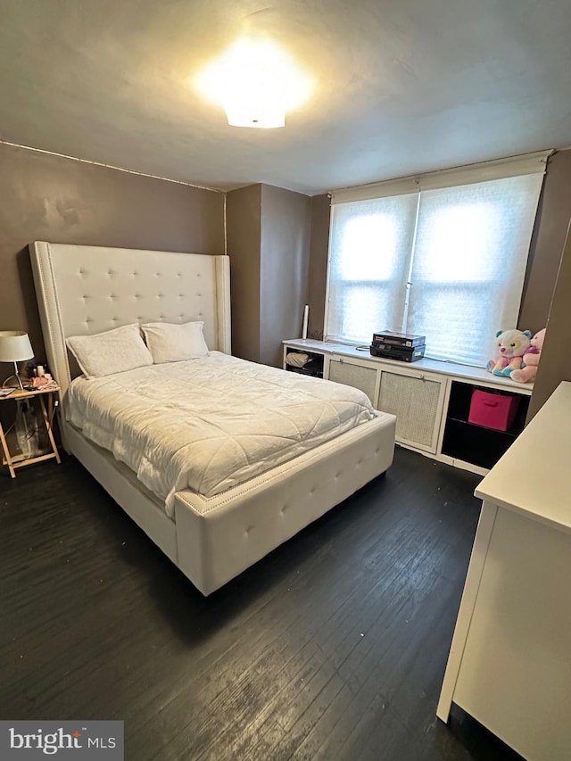 bedroom featuring dark hardwood / wood-style floors