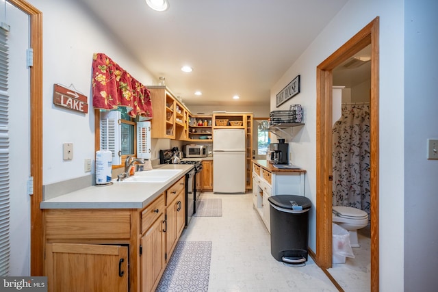 kitchen with stainless steel appliances, sink, and a healthy amount of sunlight