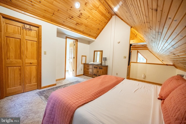 carpeted bedroom with wooden ceiling and vaulted ceiling