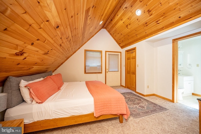 bedroom featuring connected bathroom, lofted ceiling, carpet floors, and wooden ceiling