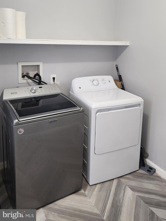 washroom featuring washing machine and dryer