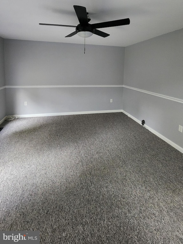 unfurnished room featuring carpet and ceiling fan