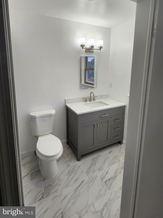 bathroom with vanity and toilet