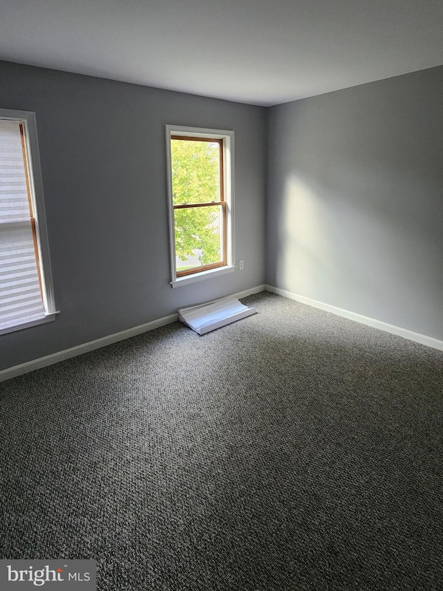 empty room with carpet flooring