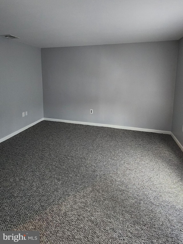 empty room with carpet flooring