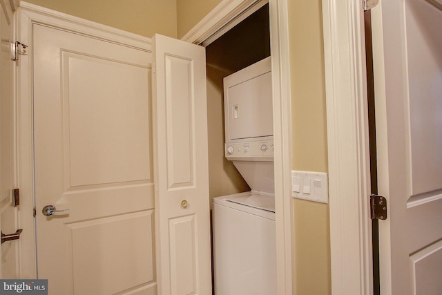 laundry room with stacked washer and clothes dryer