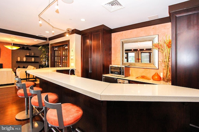 bar with dark wood-type flooring