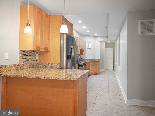 kitchen with stainless steel refrigerator with ice dispenser, kitchen peninsula, hanging light fixtures, backsplash, and light stone countertops