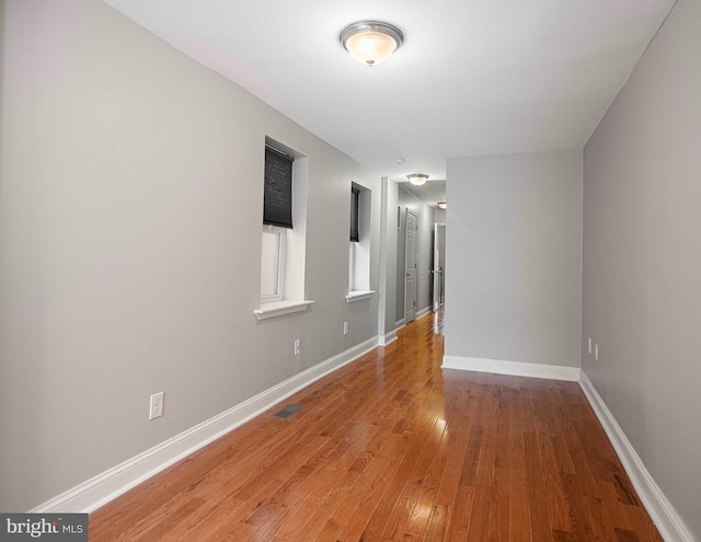 spare room featuring hardwood / wood-style floors