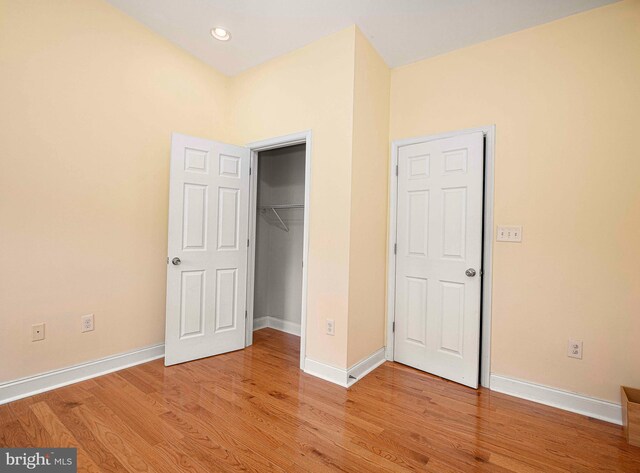 unfurnished bedroom with light wood-type flooring