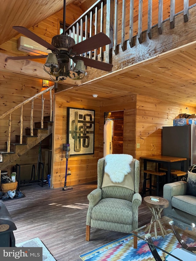 living room with high vaulted ceiling, wood walls, wooden ceiling, wood-type flooring, and ceiling fan