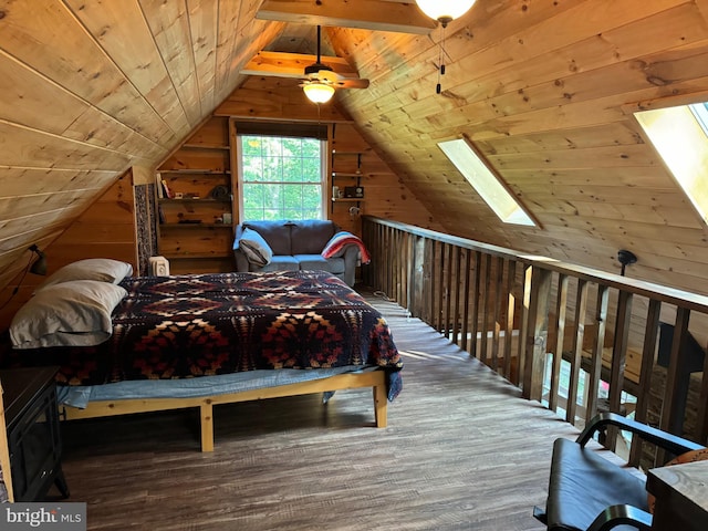 unfurnished bedroom featuring hardwood / wood-style flooring, wood walls, lofted ceiling with skylight, and wooden ceiling