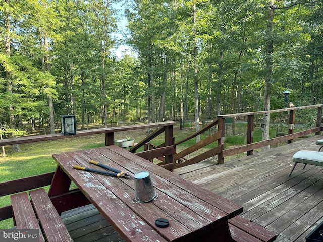 deck with a yard and a storage unit