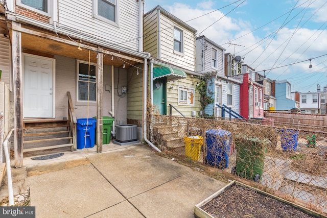 entrance to property featuring central AC unit