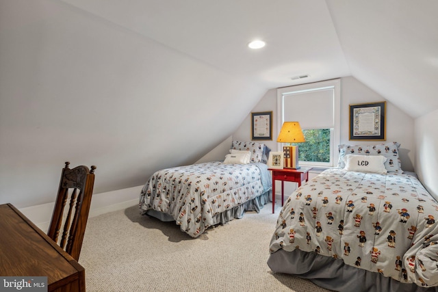 carpeted bedroom featuring vaulted ceiling