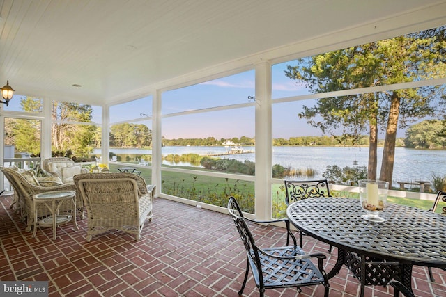 sunroom with a water view