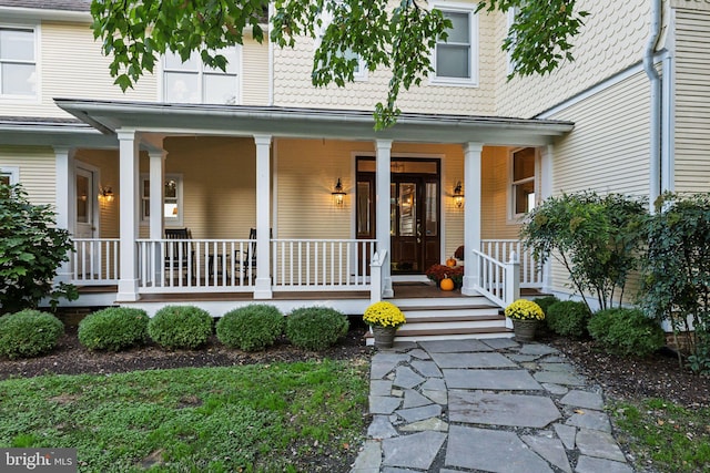 doorway to property featuring a porch