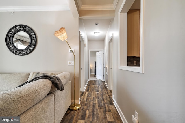 hallway featuring dark wood-type flooring and ornamental molding