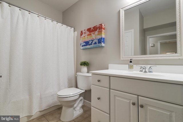 bathroom featuring vanity, curtained shower, toilet, and tile patterned floors